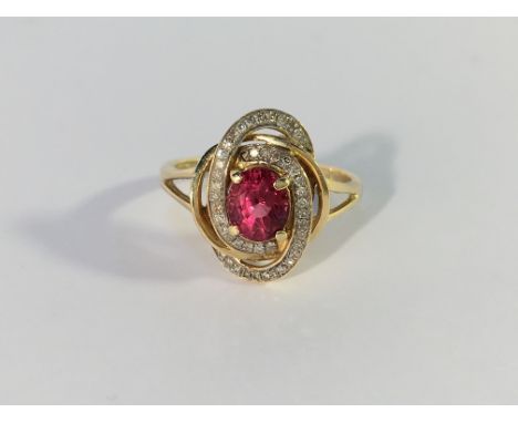 A 14ct yellow gold ruby and diamond ring, size O