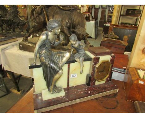 A French marble mantel clock surmounted figures of mother and daughter