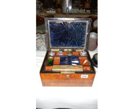 A mahogany and mother of pearl inlay vanity box with contents and key