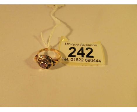 A vintage amethyst cluster ring in 18ct gold, size M