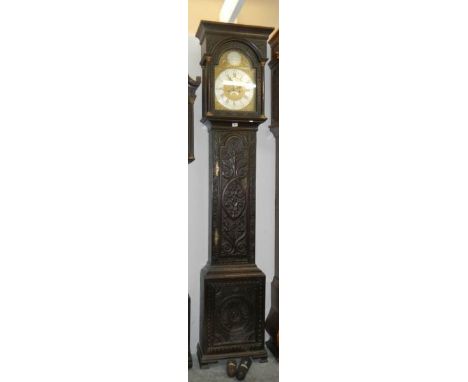 A carved oak brass faced Grandfather clock, Will Snow, PadsideBottom front panel has split running top to bottom along grain 
