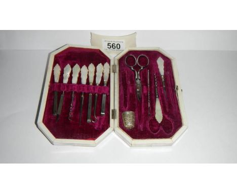 A mother of pearl cased manicure set (odd contents)