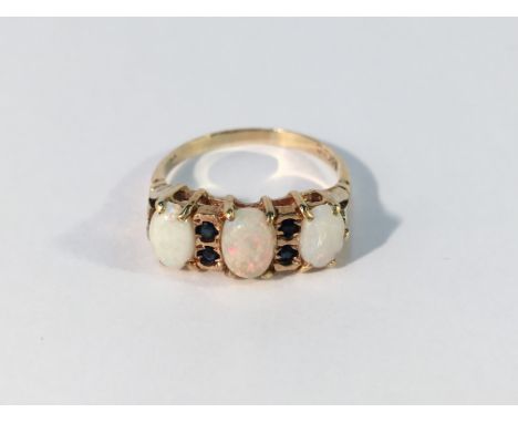 An opal and sapphire 3 stone ring in 9ct gold