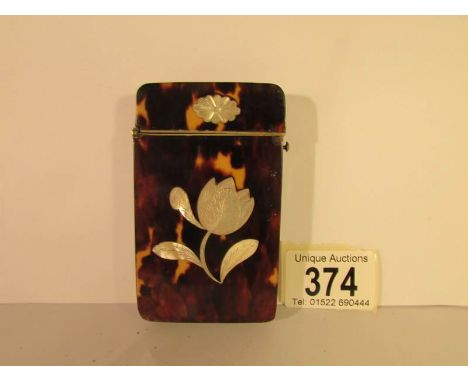 A 19th century tortoise shell card case inlaid with mother of pearl, 9 x 5.5 cm