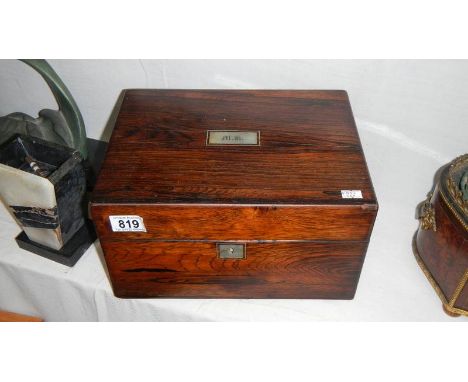 A rosewood and mother of pearl vanity box with blue silk interior, contents and key