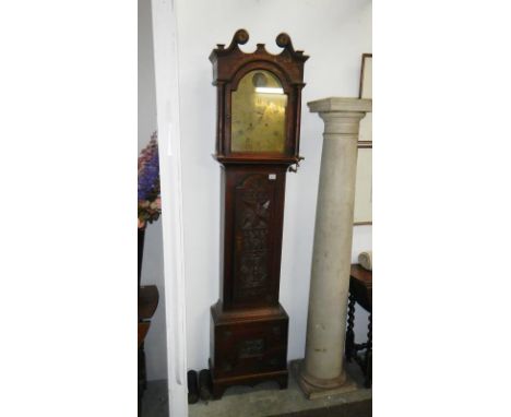 An 18th Century oak longcase clock with 'John Spinks Revesby' brass arch 8 day automaton movement. Dated Allenby 1773 inside 