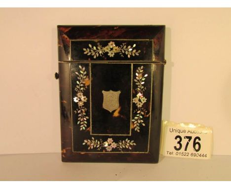 A 19th century tortoise shell card case inlaid with mother of pearl and monogrammed, 10 x 78 cm
