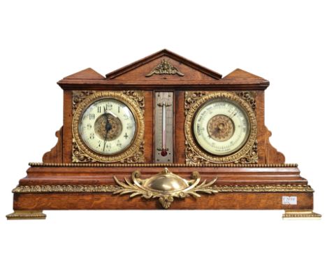 An oak cased clock/barometerClock glass has a chip & crack at the bottom & nibbles on edgeGilding faded in places otherwise i