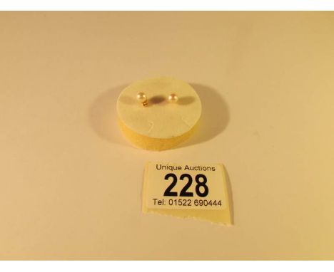 A pair of cultured pearl ear studs