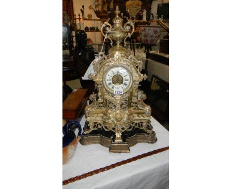 A tall Victorian brass mantel clock