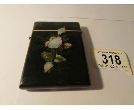 A mother of pearl and lacquered card case, 9 x 6.5 cm