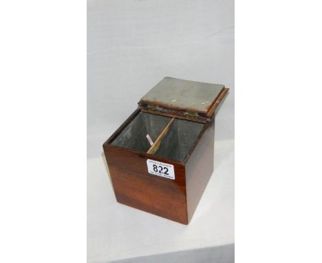 A mahogany tea caddy