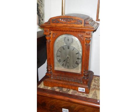 A 3 train oak bracket clock with silver dial