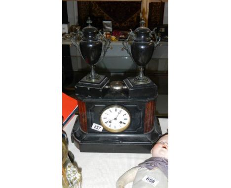 A Victorian black 3 piece clock garniture in working order