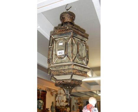 A metal and glass lantern