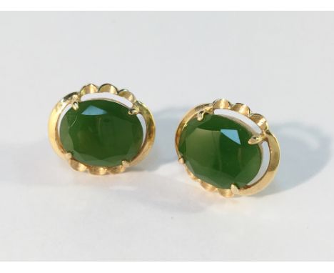 A pair of 18ct gold and jade earrings