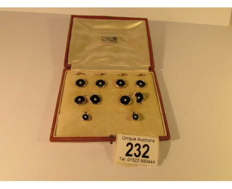 A cased set of 18ct gold enamel and pearl set collar studs and cuff links
