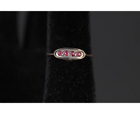 A 9ct gold four stone ruby ring