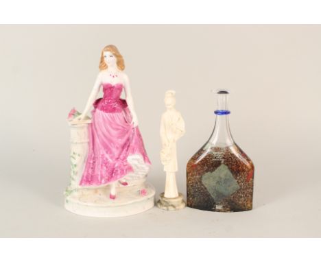 A Royal Worcester Midnight Rendezvous figurine plus one other and a Kosta Boda bottle vase