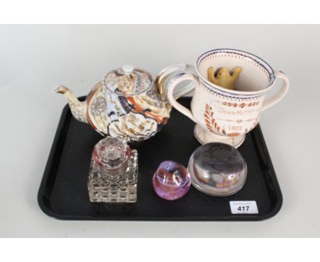 A Japanese teapot, frog mug (as found), cut glass inkwell plus two paperweights, one Caithness and two Royal Doulton characte