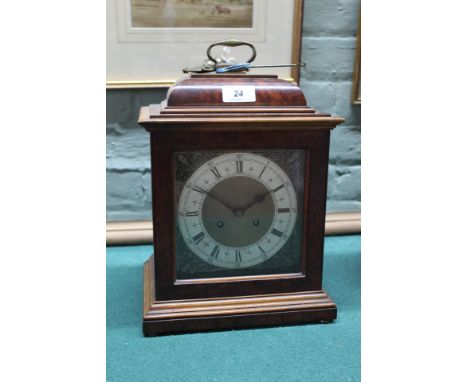 A walnut and mahogany striking bracket clock