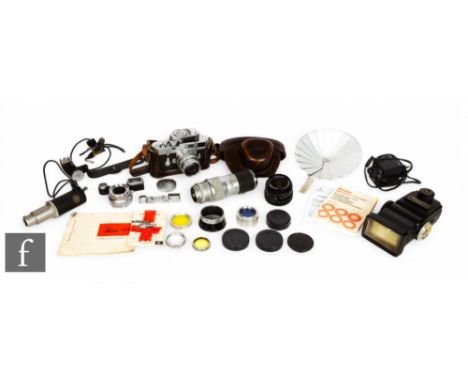 A Leica M3 camera outfit, circa 1957, to include camera M3 - 885 460, fitted with Summicron lens f= 5cm 1:2 Nr 1474318, in le