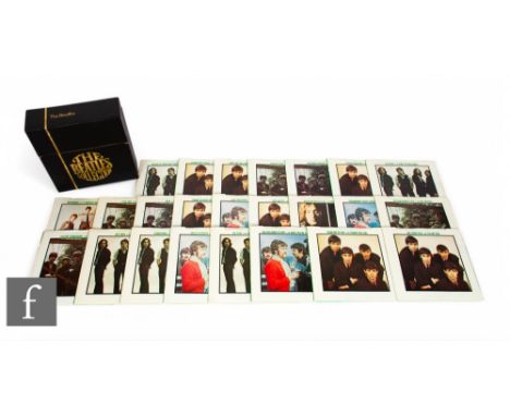 The Beatles - The Singles Collection 1962-1970, twenty four 7" singles in gold embossed black case, lacking insert.