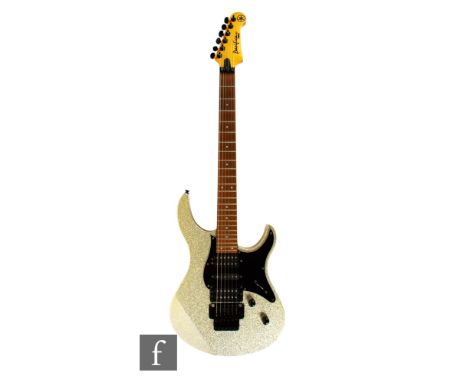 A Yamaha Pacifica 821 electric guitar, in gold gloss finish, indistinct serial number IJ20103, sold with Ritter carry case.