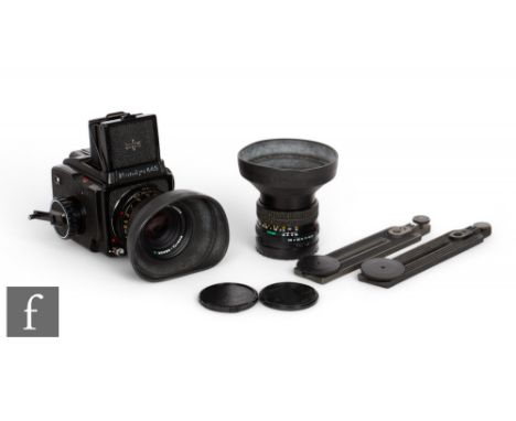 A Mamiya 645 medium format camera, together with a Mamiya - Sekor 1:28 f = 80mm No.172066 lens, and a 55mm 1:28 Mamiya-Sekor 