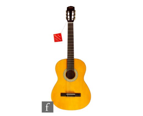A Squier by Fender model SA-150N acoustic guitar CKGK17002203, with original label and box.