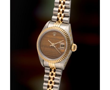 A LADY'S STEEL & GOLD ROLEX OYSTER PERPETUAL DATEJUST BRACELET WATCHDATED 1990, REF. 69173 WITH LATER SPECIAL ORDER TIGER'S E