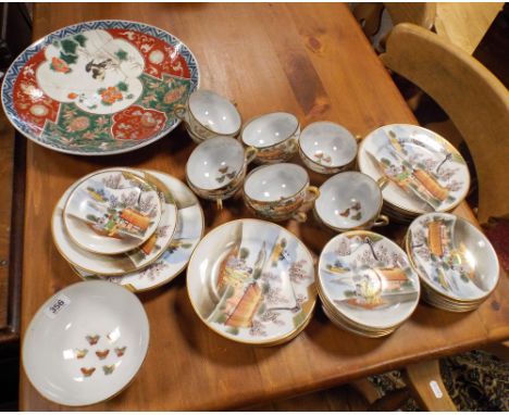 A Japanese eggshell porcelain tea service and a charger together with a pink glass dressing table set and glass bird decorate