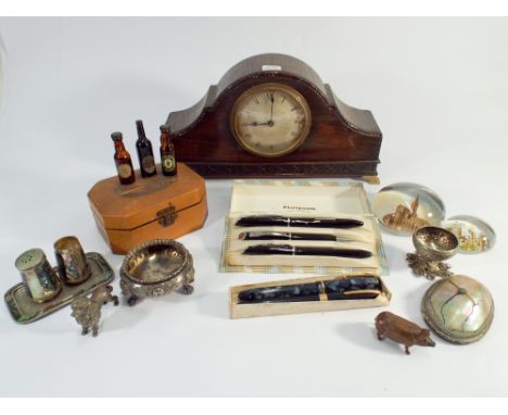 Small oak mantel clock, fountain pens, silver plated items, paperweights and other general collectables.