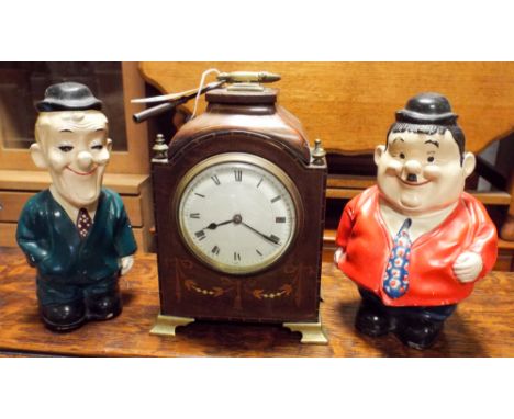 Edwardian inlaid mahogany mantle clock with key and a pair of novelty Laurel and Hardy plaster money boxes