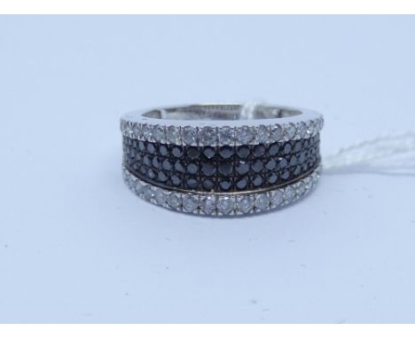 Modern white and black diamond half hoop ring, paves et in a wide band, 9ct white gold, ring size K