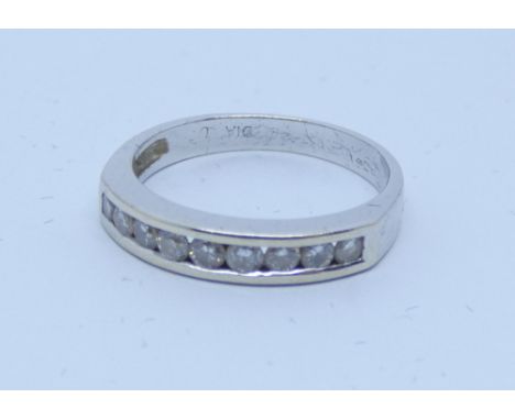 18ct white gold diamond set half hoop ring, channel set with nine brilliant cut diamonds. Size K 