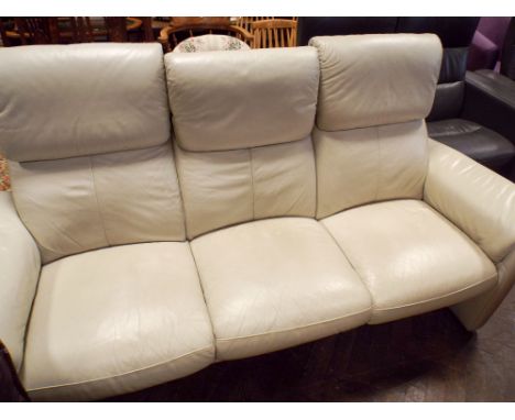 An ivory leather three seater Ekornes reclining three seater sofa  This appears to be in very good condition, no scuffs tears