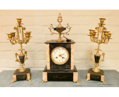 A French black and rouge marble three piece clock garniture 