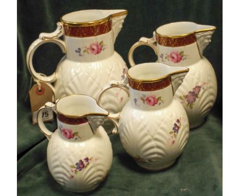Set of four graduated Coalport Caughley mask head jugs 