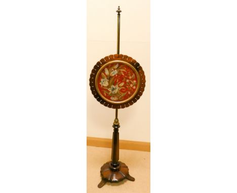 An early Victorian Rosewood circular pole screen with tapestry panel 