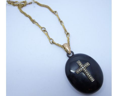Victorian oval mourning locket, with hair inset to glazed panel on a gilt metal watch albert.  Locket Measures 5.5cm long, 7 