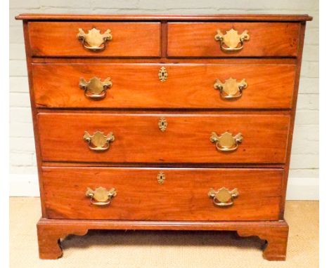 A Georgian mahogany chest of three long and two short drawers with brass fall handles standing on bracket feet 37" wide 