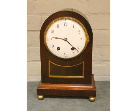 An Edwardian striking bracket clock in arched top mahogany case 