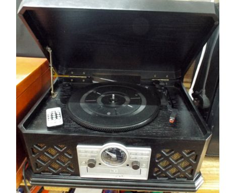 A radio, CD player, record deck in an old black box style case 