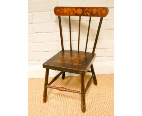 A child's stick back chair with gilt floral painted decoration 