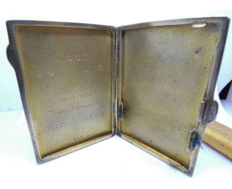 A Cartier gold plated pocket lighter, numbered '66146C', accompanied by a silver cigarette case with an inscription, 'GENERAL