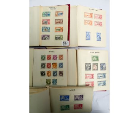 Collection of 5 stamp albums contacting mostly British and Commonwealth stamps from the 1930s to the 1950s  