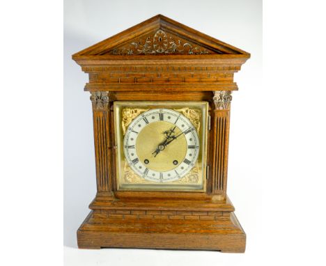 An Edwardian striking bracket clock with square brass and silver dial in oak case 