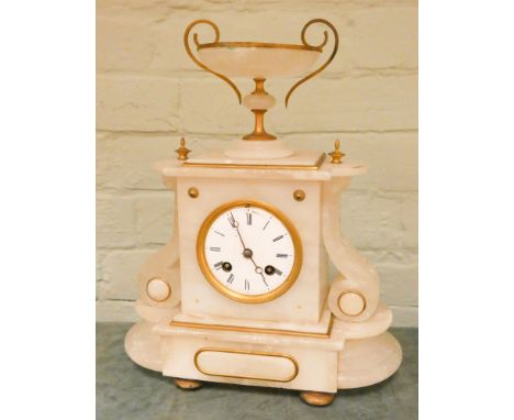 A French striking mantle clock in white onyx case with a bowl shaped top 