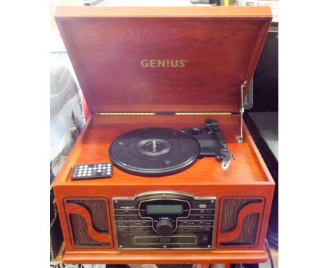 A radio, CD player, record deck in an old style cabinet 